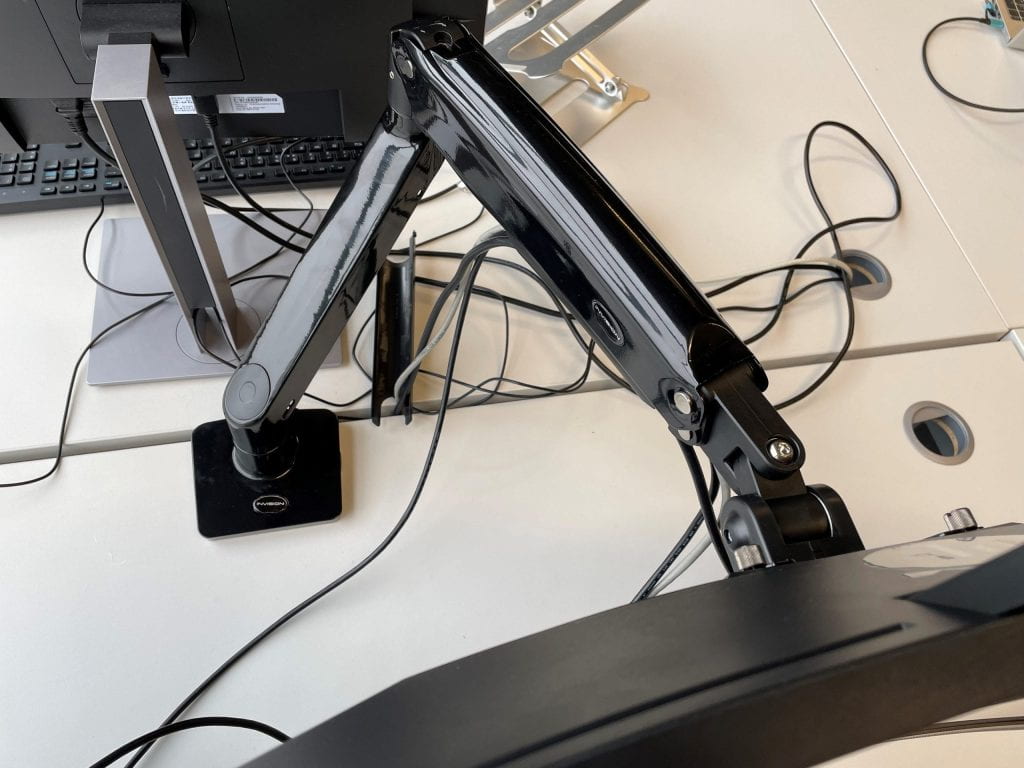 A picture of the monitor arm or stand holding the monitor.